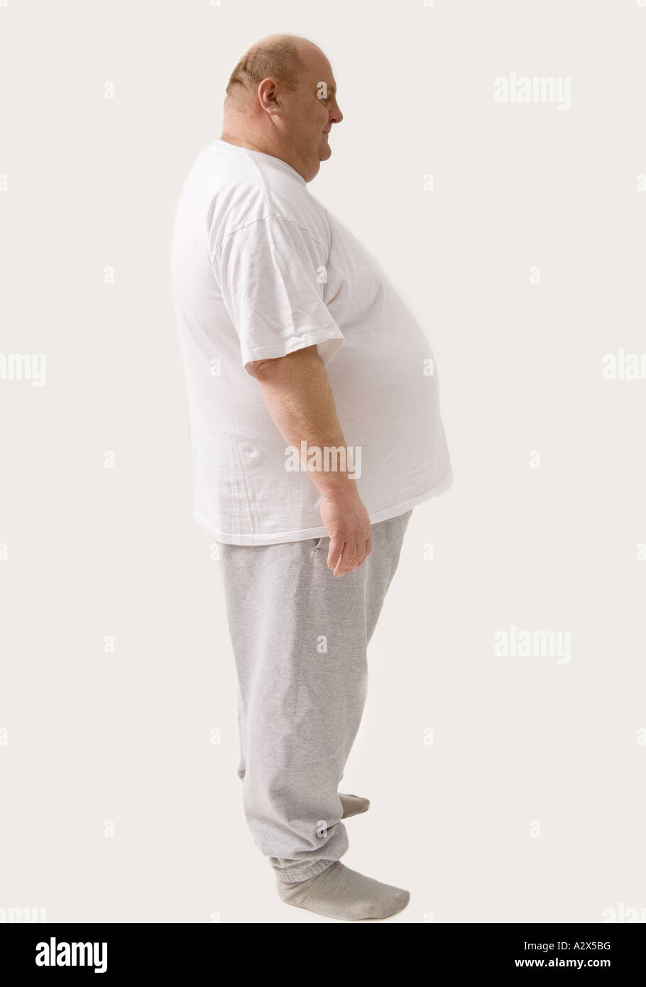 Big man standing in a lateral position. Stock Photo