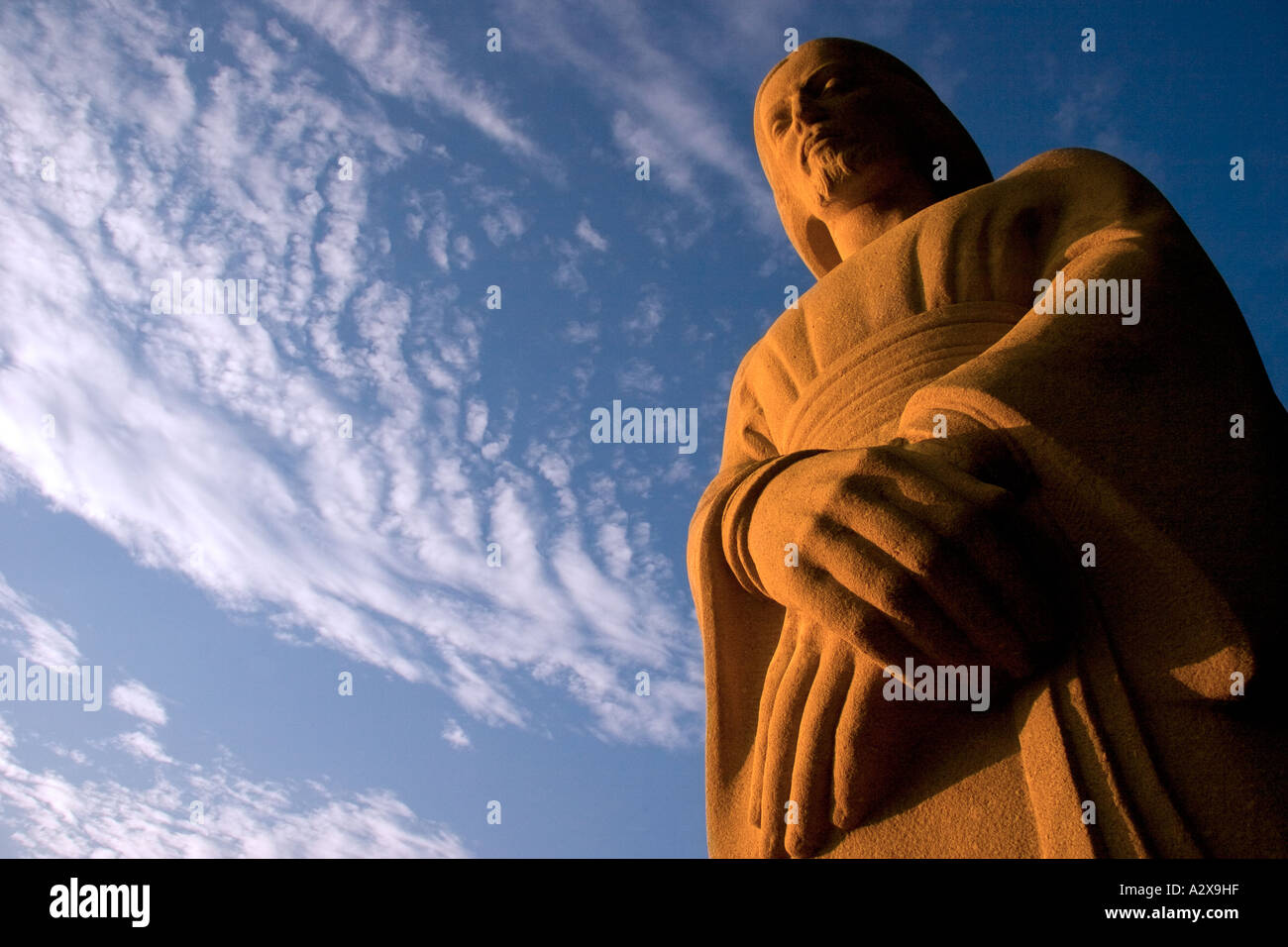 Statue of Christ against a cloudy , blue sky Stock Photo - Alamy