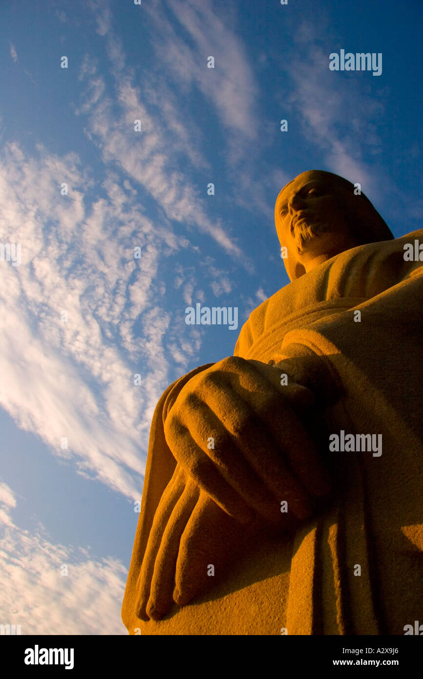 Statue of Christ against a cloudy , blue sky Stock Photo - Alamy