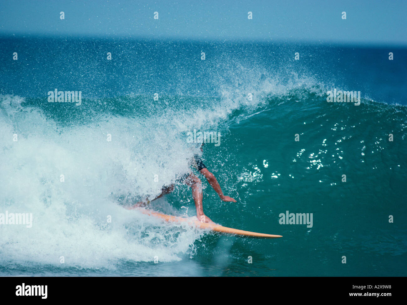 Surfing man in barrel wave. Stock Photo