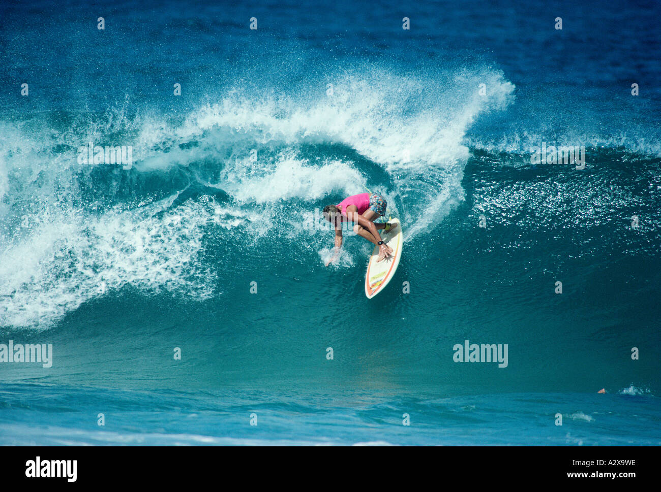 Surfing man on crashing wave. Stock Photo