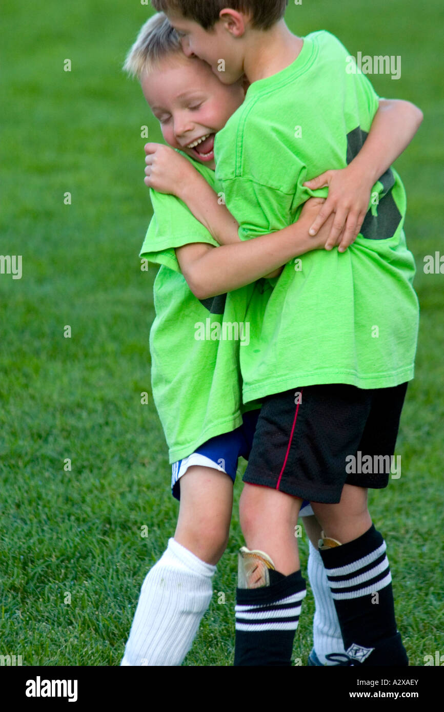Joyous soccer players celebrating a goal age 5. St Paul Minnesota USA Stock Photo