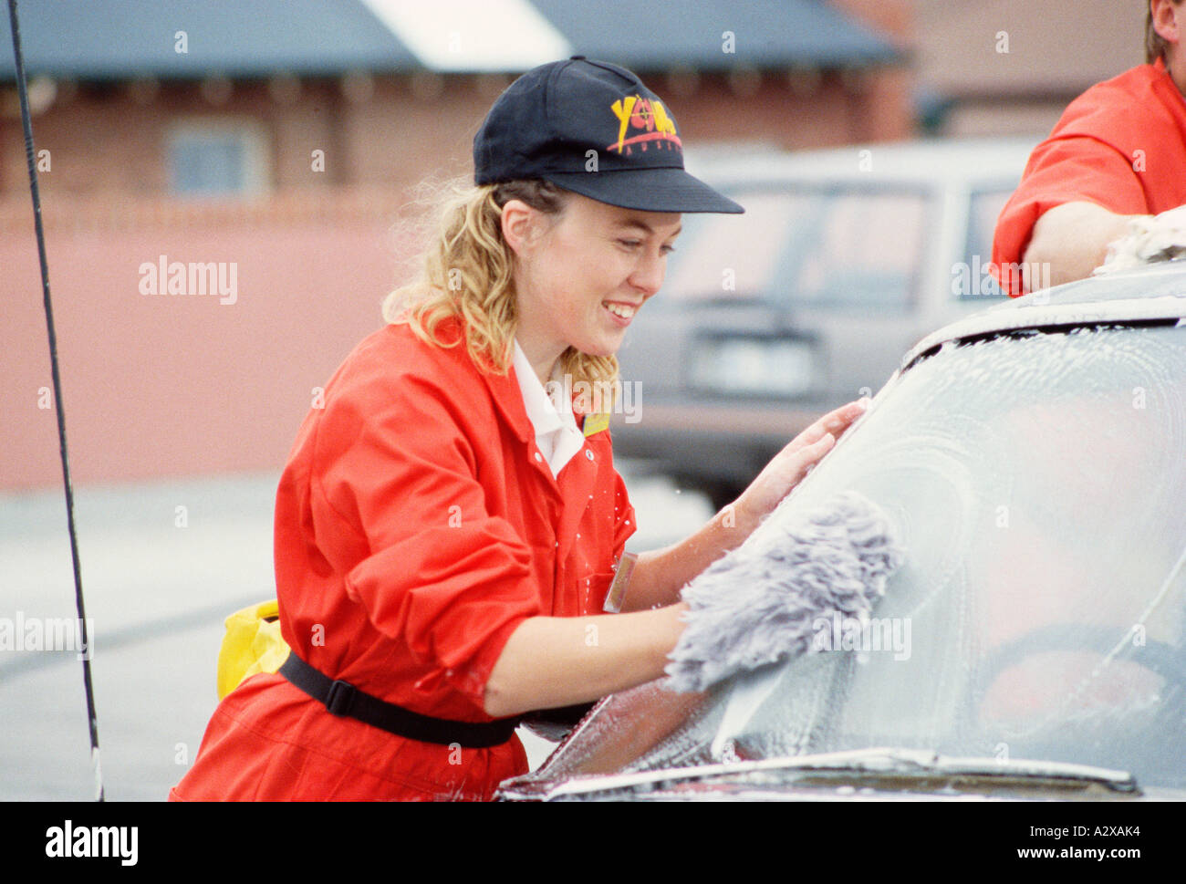 Car wash woman washing windscreen Stock Photo Alamy