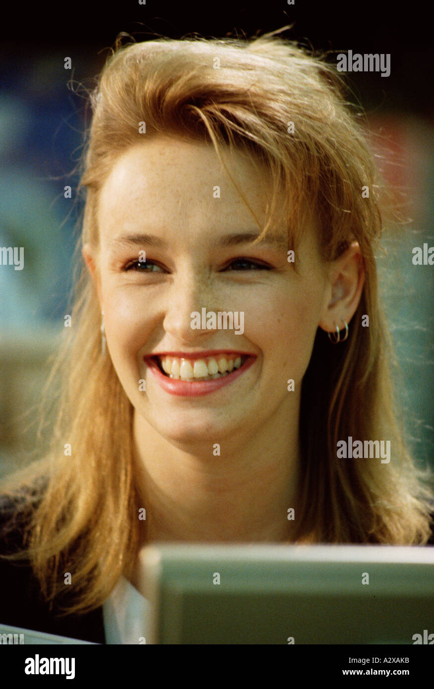 Indoor portrait of happy smiling young blond woman Stock Photo - Alamy