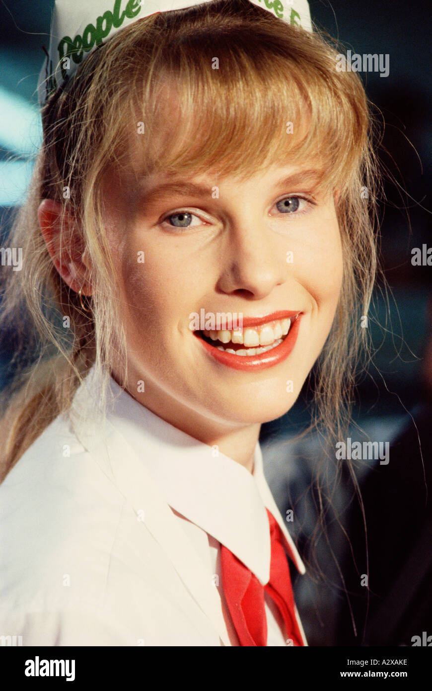 Close-up indoor portrait of young waitress. Stock Photo