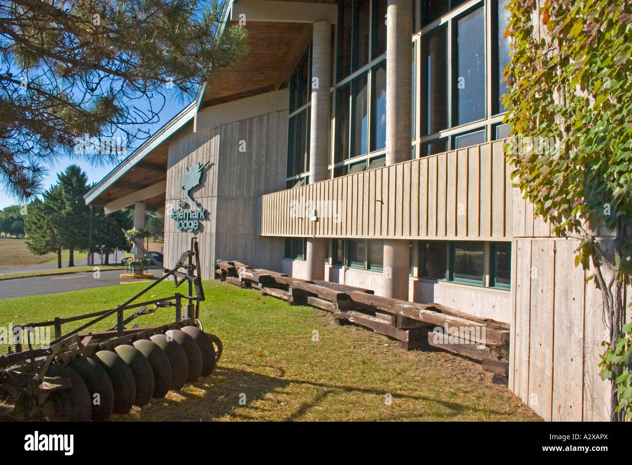 Antique farm disk harrow decorating the lawn of Telemark Ski Lodge