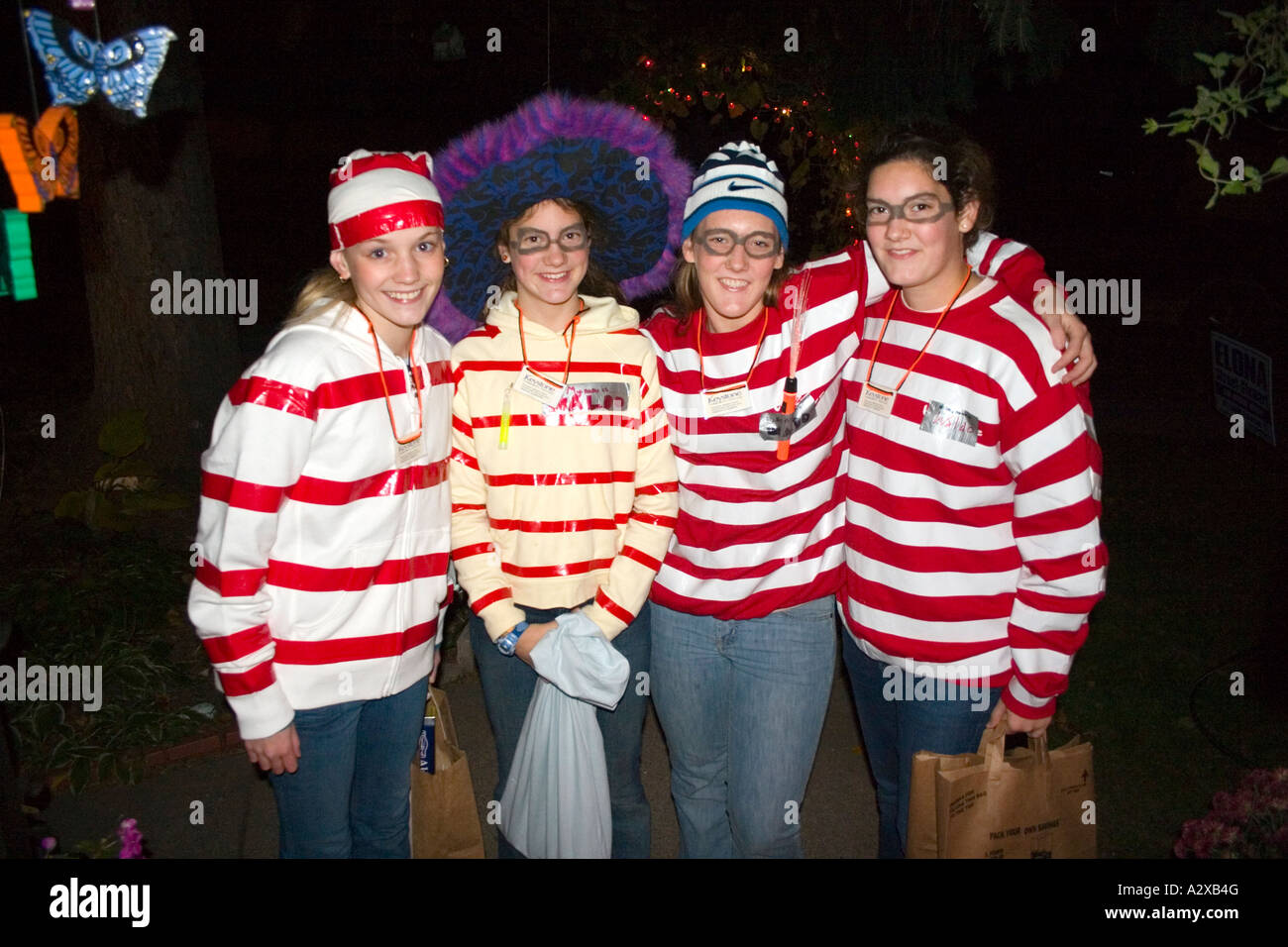 Halloween Keystone convict prisoner trick and treaters in red striped costumes age 18. St Paul Minnesota USA Stock Photo