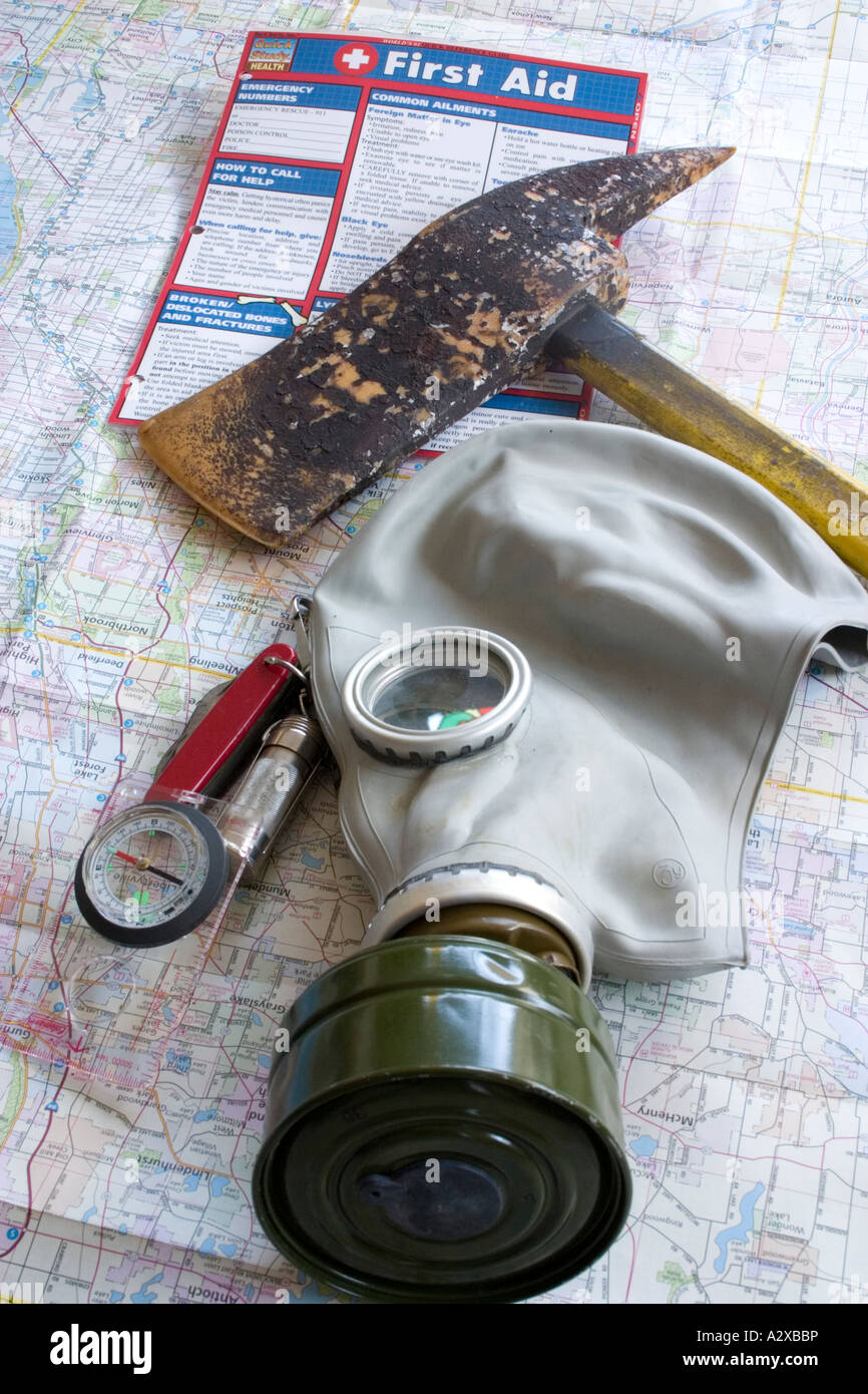 First Aid survival kit containing ax gas mask knife compass matches map. Plainfield Illinois USA Stock Photo