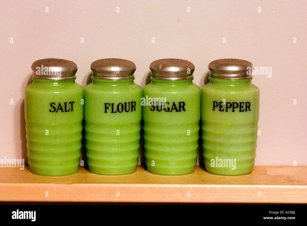 https://c8.alamy.com/comp/A2XBJJ/lime-green-antique-salt-and-pepper-shakers-on-kitchen-shelf-downers-A2XBJJ.jpg