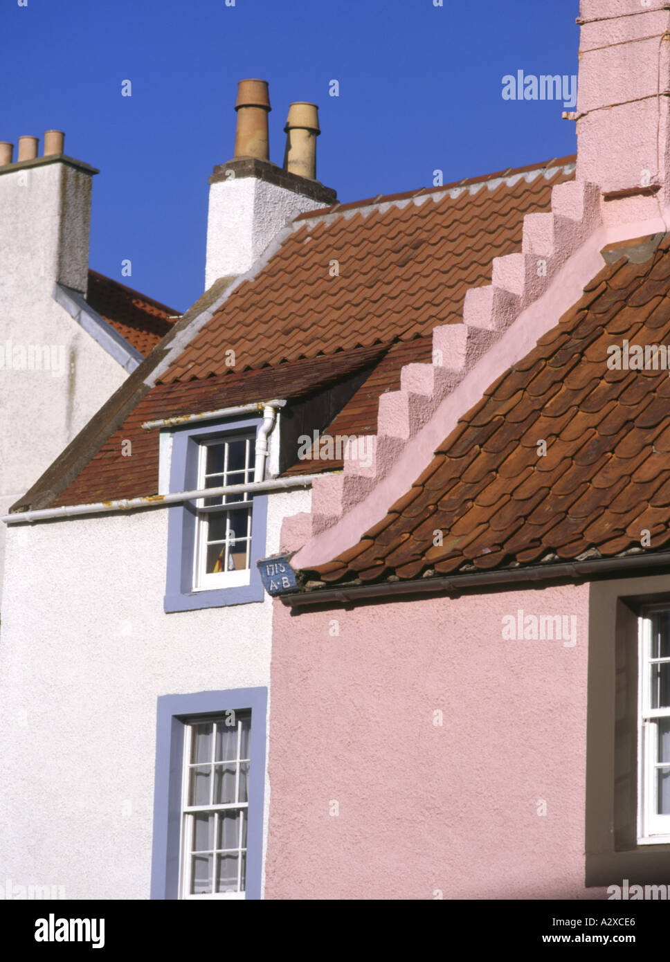 dh East neuk house ST MONANCE FIFE White Pink walls painted window red pan tiled houses roof tiles crow stepped gable scotland uk pantiled end Stock Photo