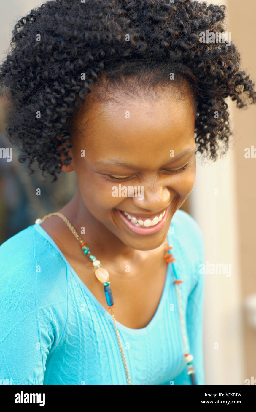 Close up on young African woman laughing Stock Photo - Alamy