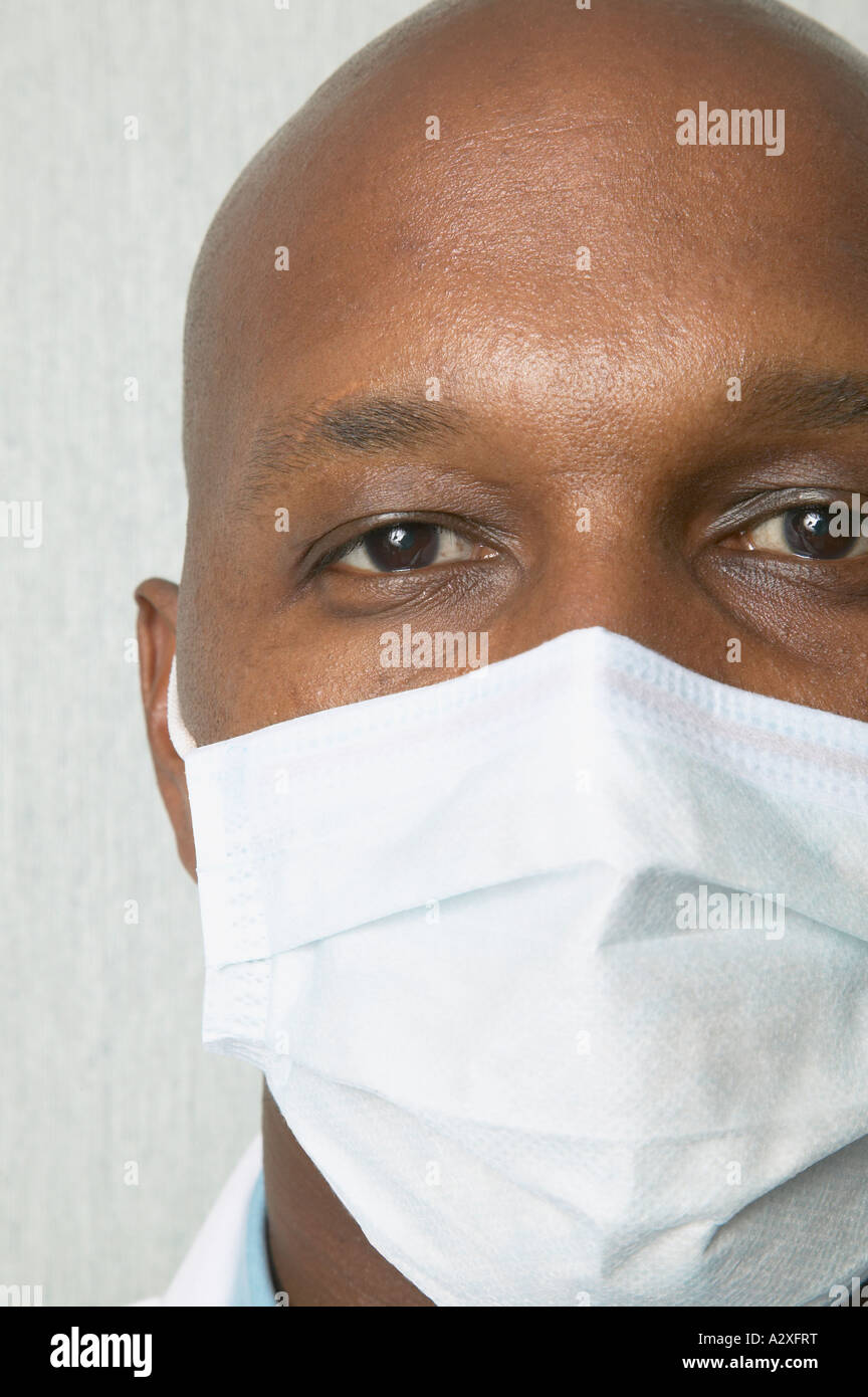 Close up of African man wearing surgical mask Stock Photo - Alamy