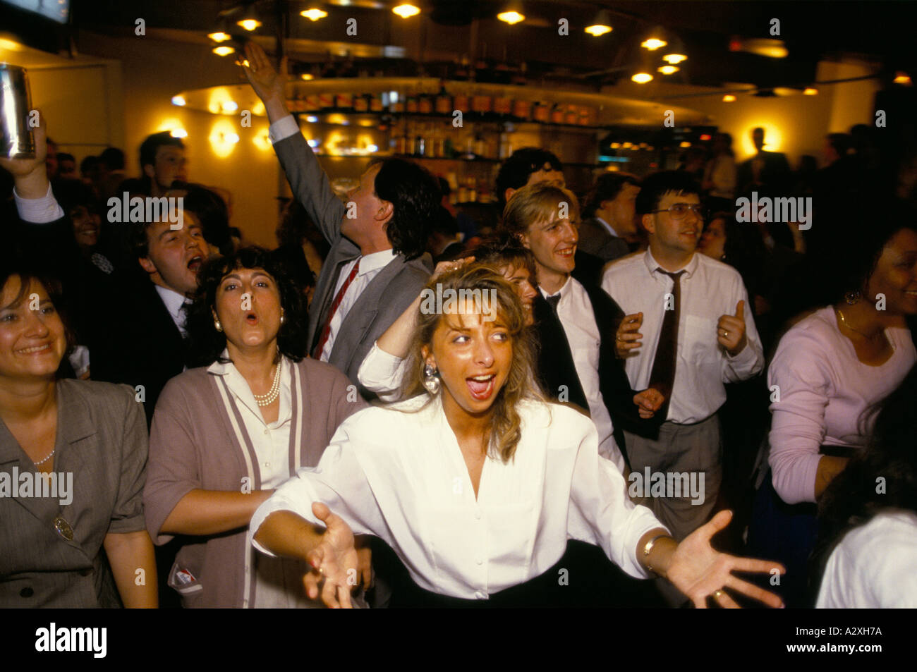 crowd of city workers singing karaoke after work coates wine bar city
