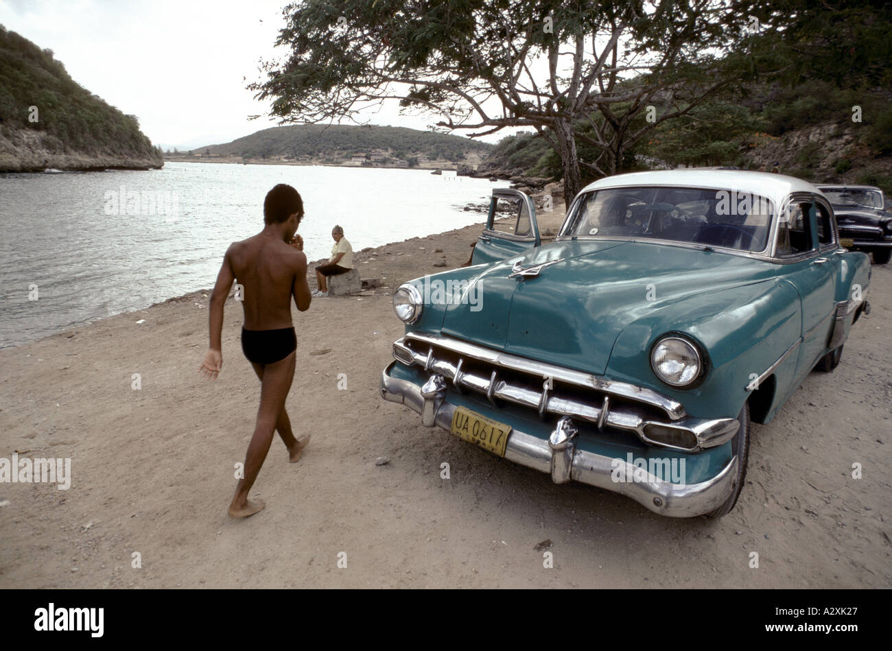 Old classic American car on a beach in Cuba Stock Photo