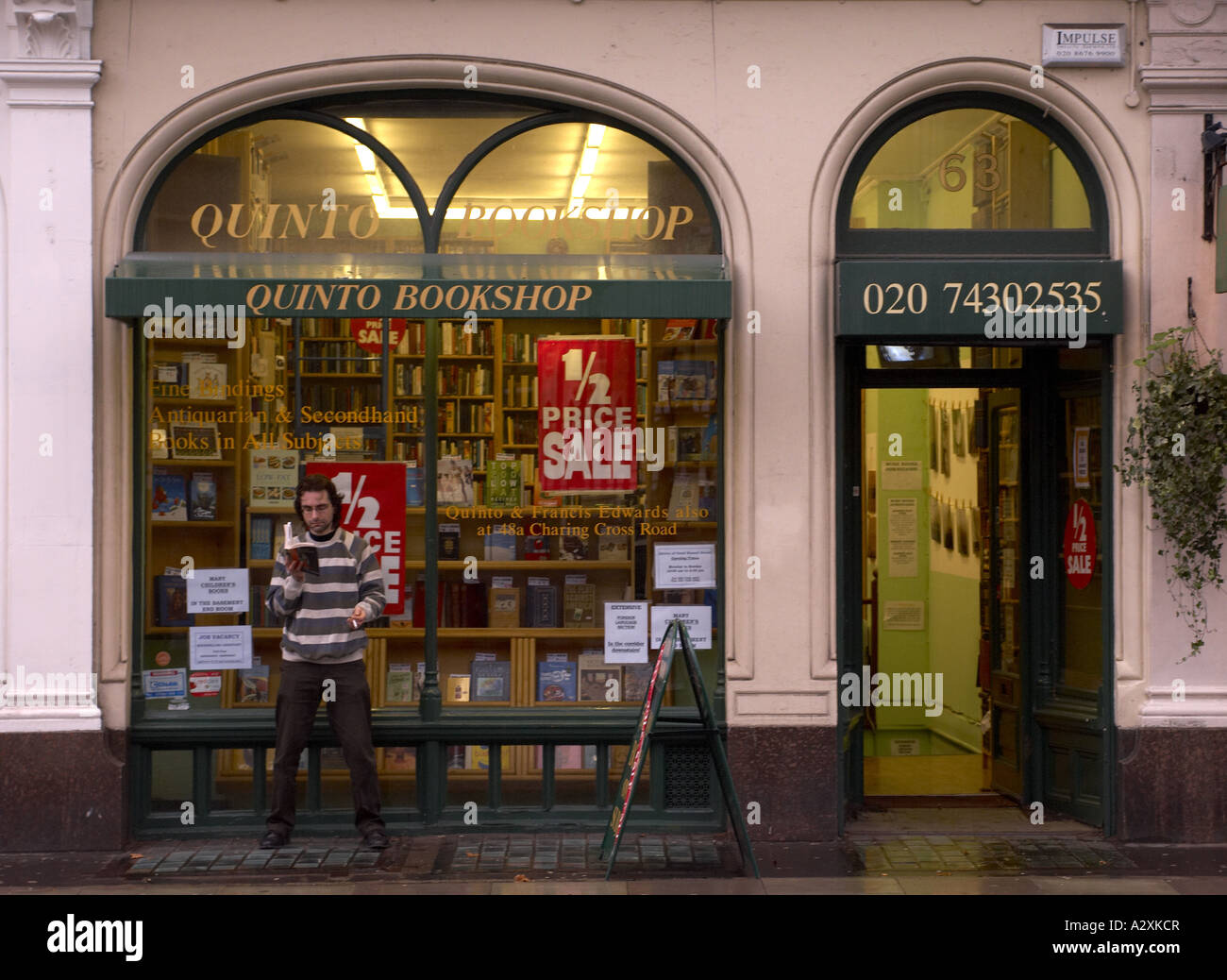 Man reading in front of Quinto rare and antique books dealers