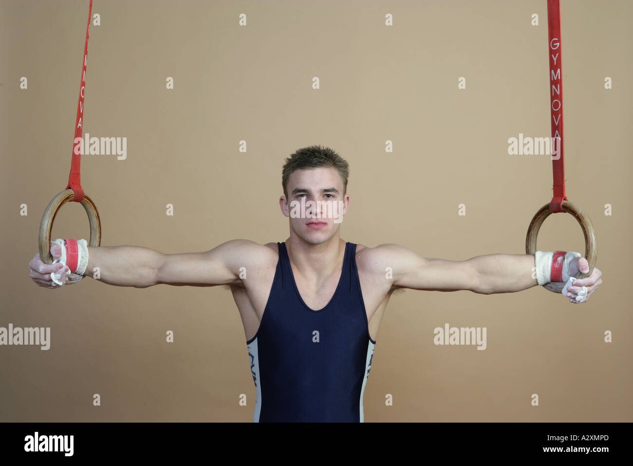 man on rings doing crusifix,Olympics 2012 Stock Photo