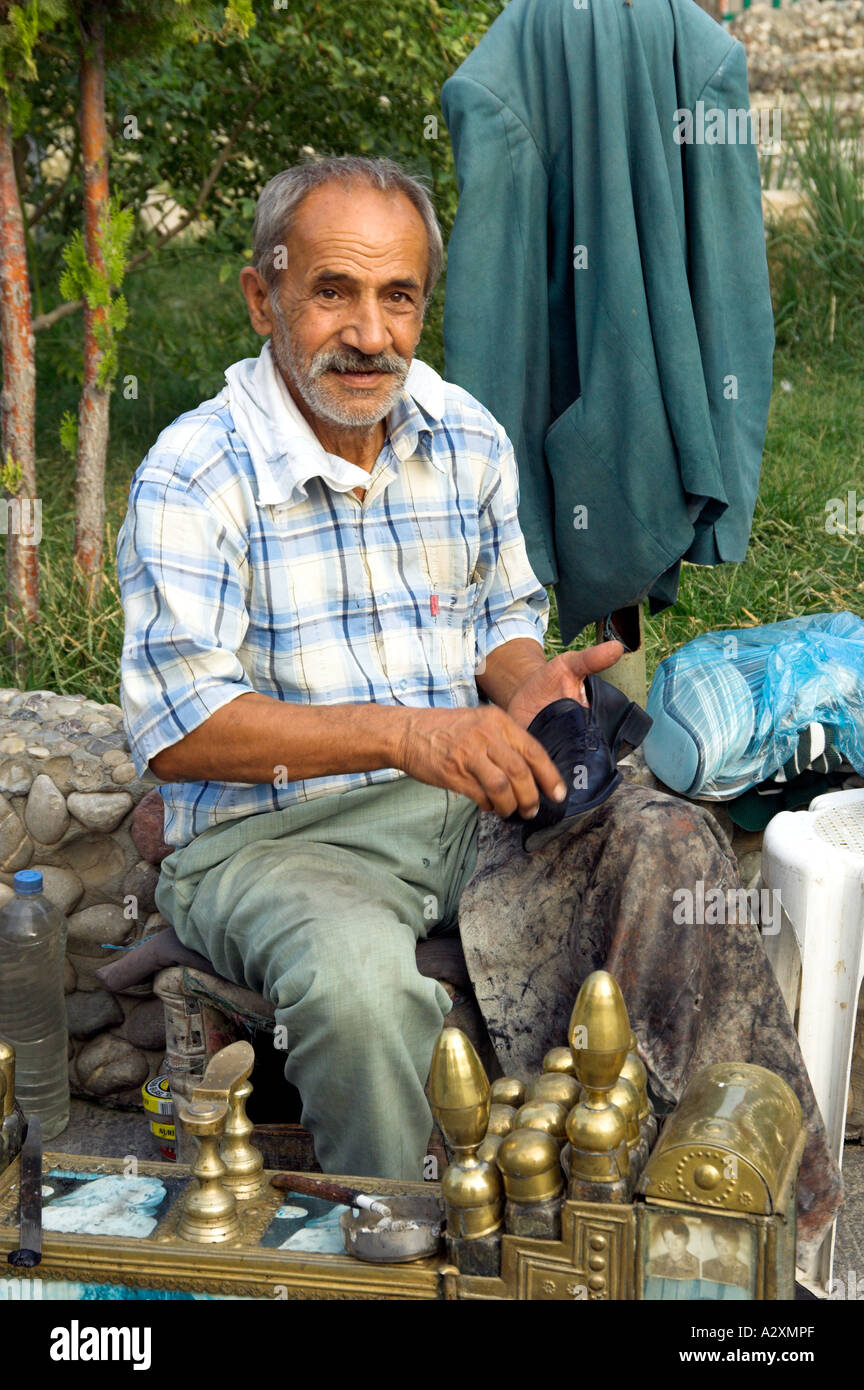 A turkish man provides a shoe shine service at a roadside rest stop in rural Turkey Stock Photo