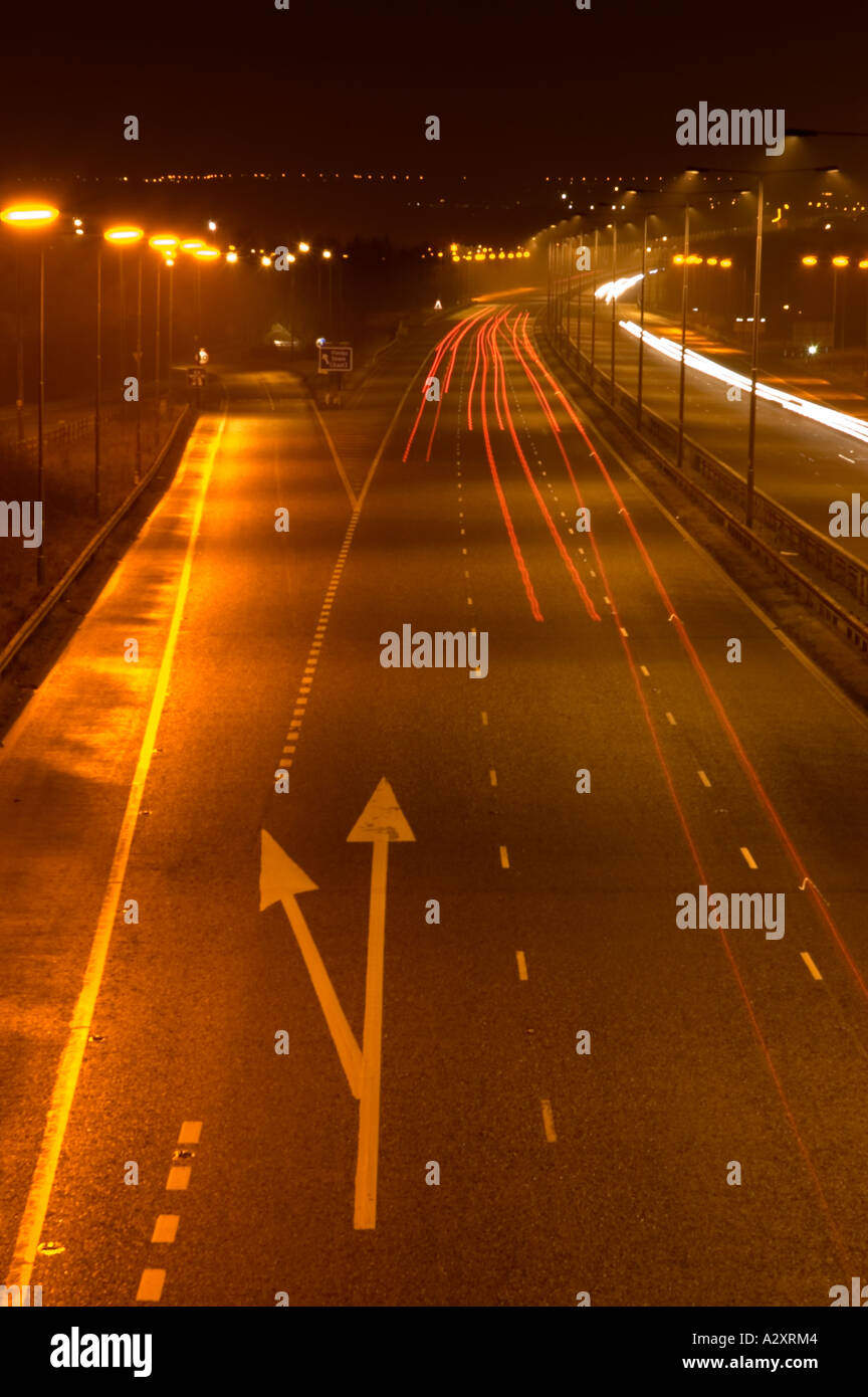Traffic trails on the motorway at night Stock Photo - Alamy