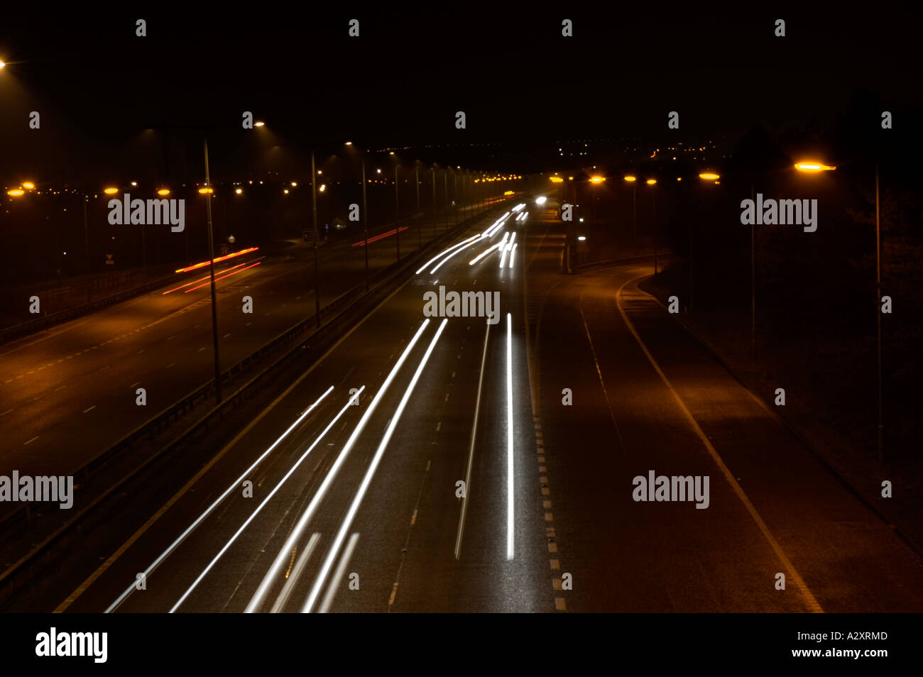 Traffic trails on the motorway at night Stock Photo - Alamy