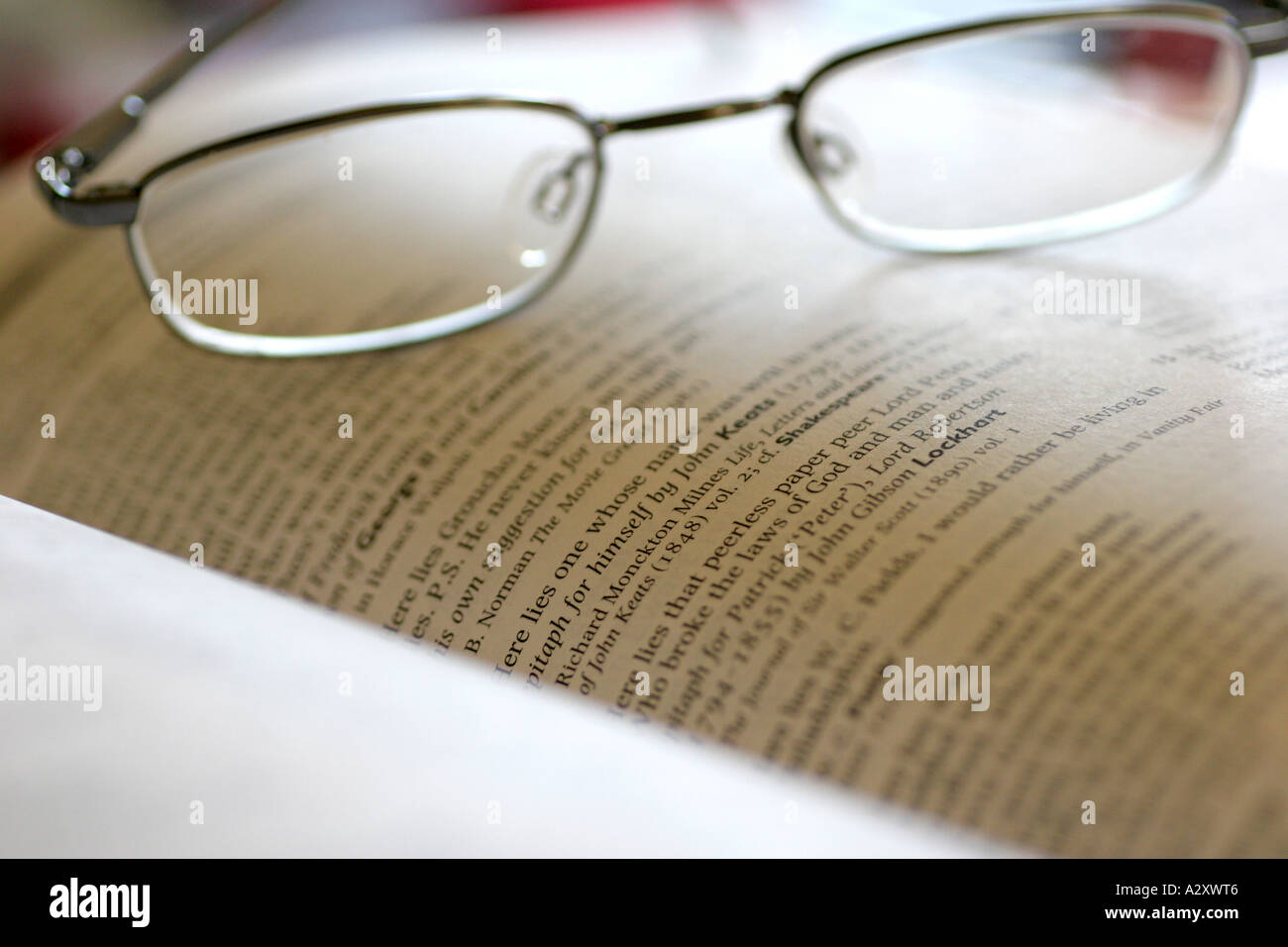 Reading glasses resting on open hi-res stock photography and images - Alamy