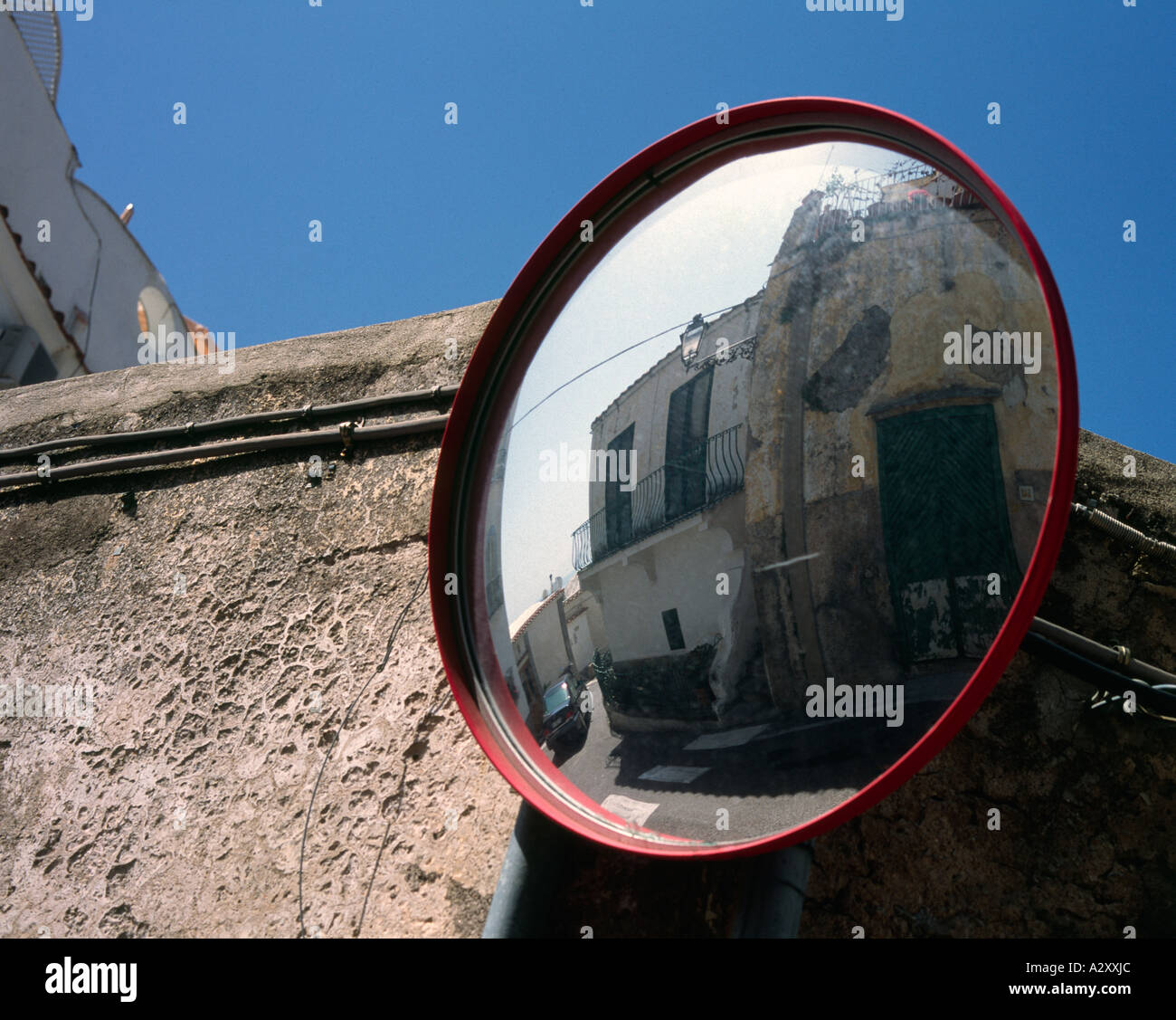 a convex mirror used on sharp corners in Italy Stock Photo Alamy