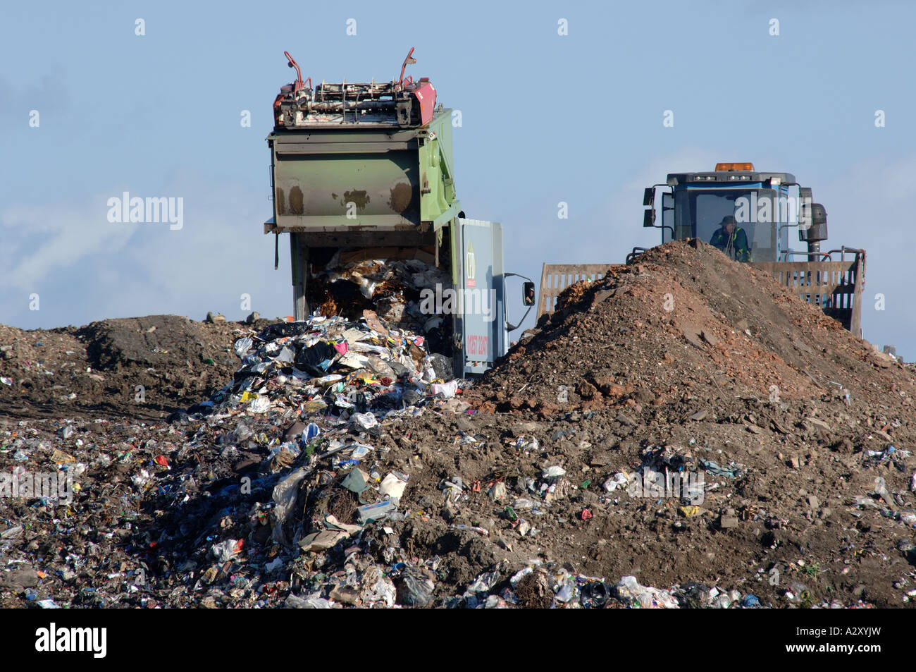 Refuse collection lorry tipping waste on landfill site Stock Photo Alamy