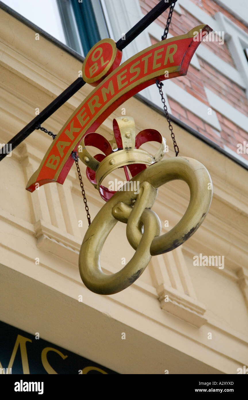 Close-up of Royal Master Baker's sign of a giant Prezel hanging outside a store in Oslo, Norway. Stock Photo