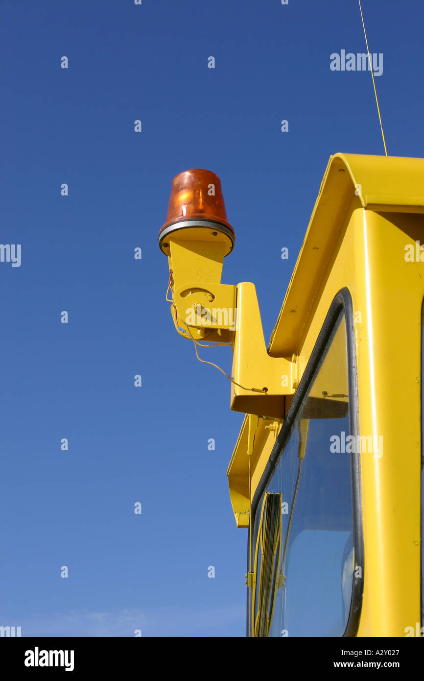 orange flashing light against blue sky Stock Photo