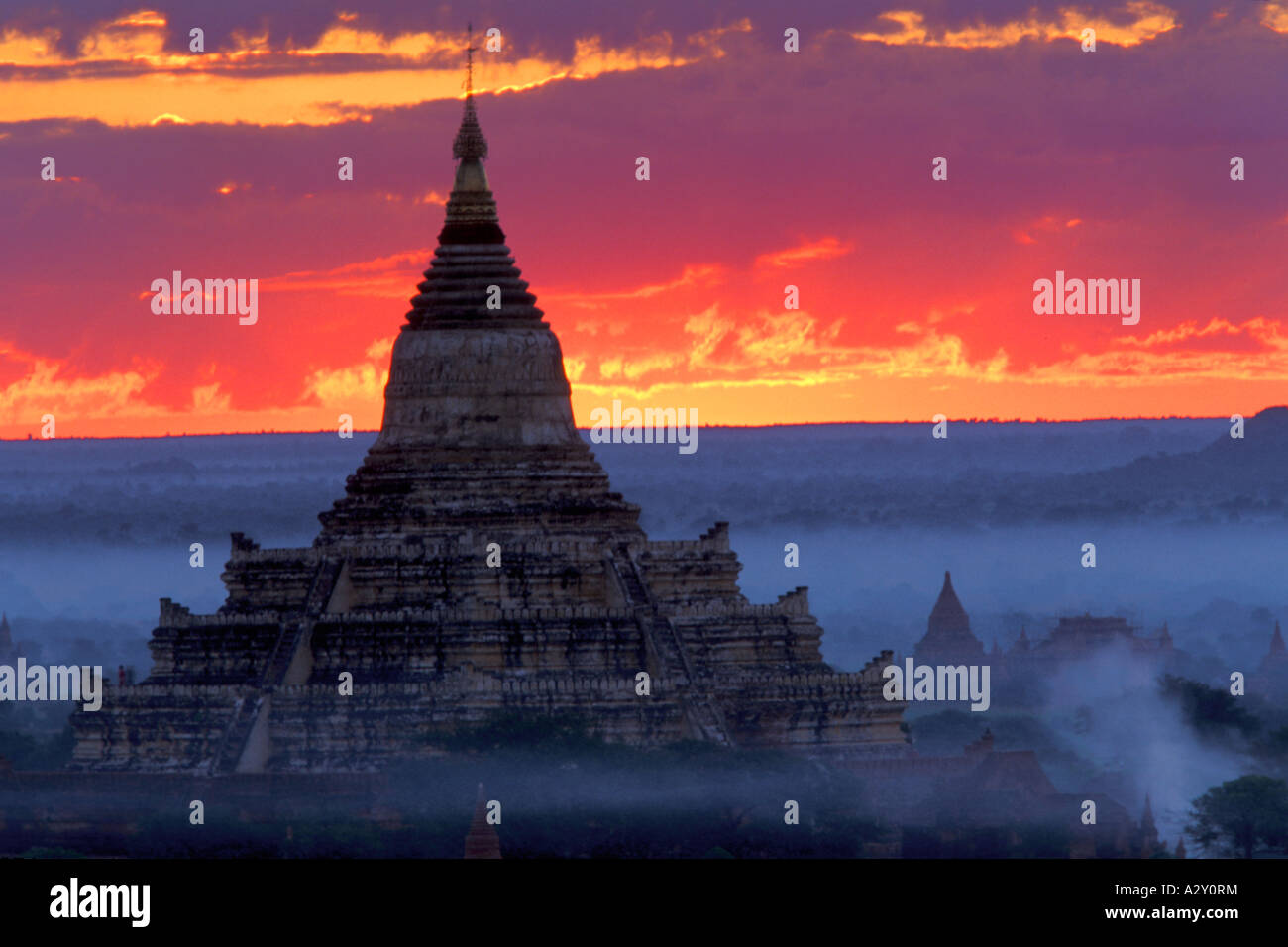 The Sun Rises Behind Dhammayangyi Pahto, Bagan, Myanmar Stock Photo