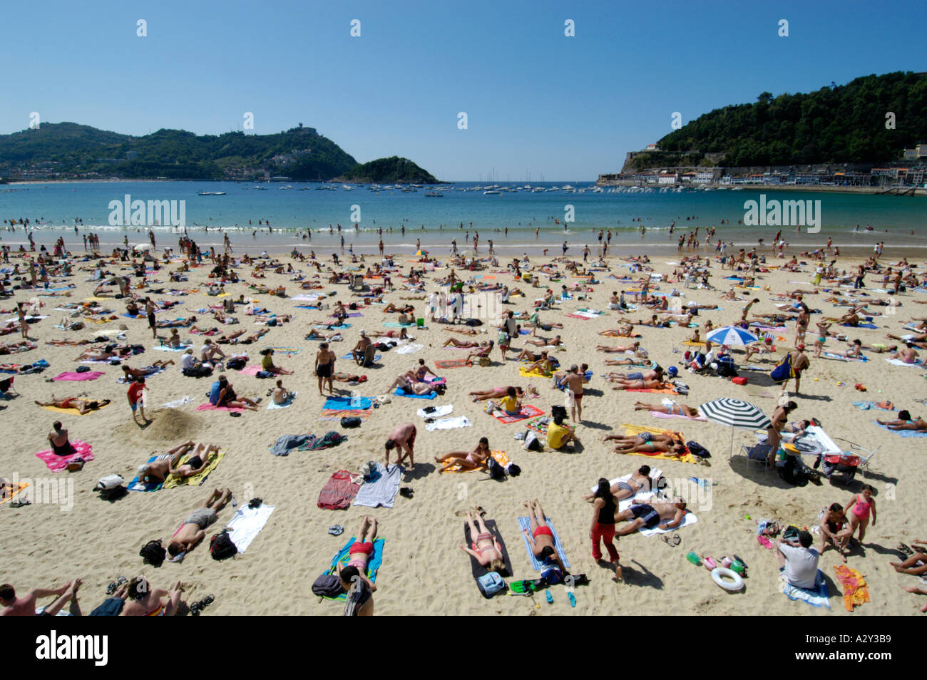 People on the beach at La Concha beach, San Sebastian, Spain Stock Photo