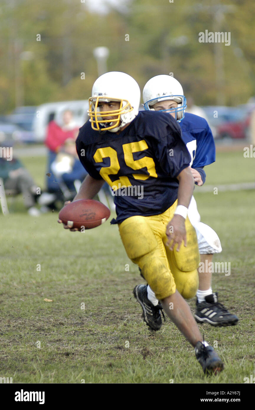 Middle school football action Stock Photo
