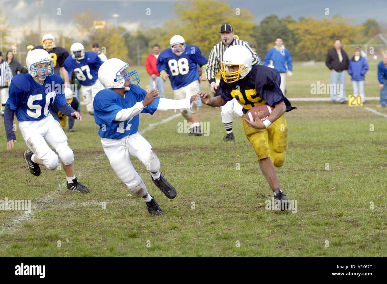 Middle school football action Stock Photo