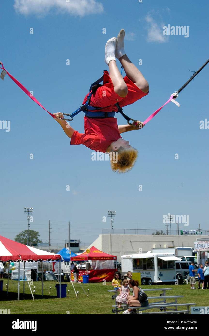Young boy having fun on a carnival ride Stock Photo - Alamy