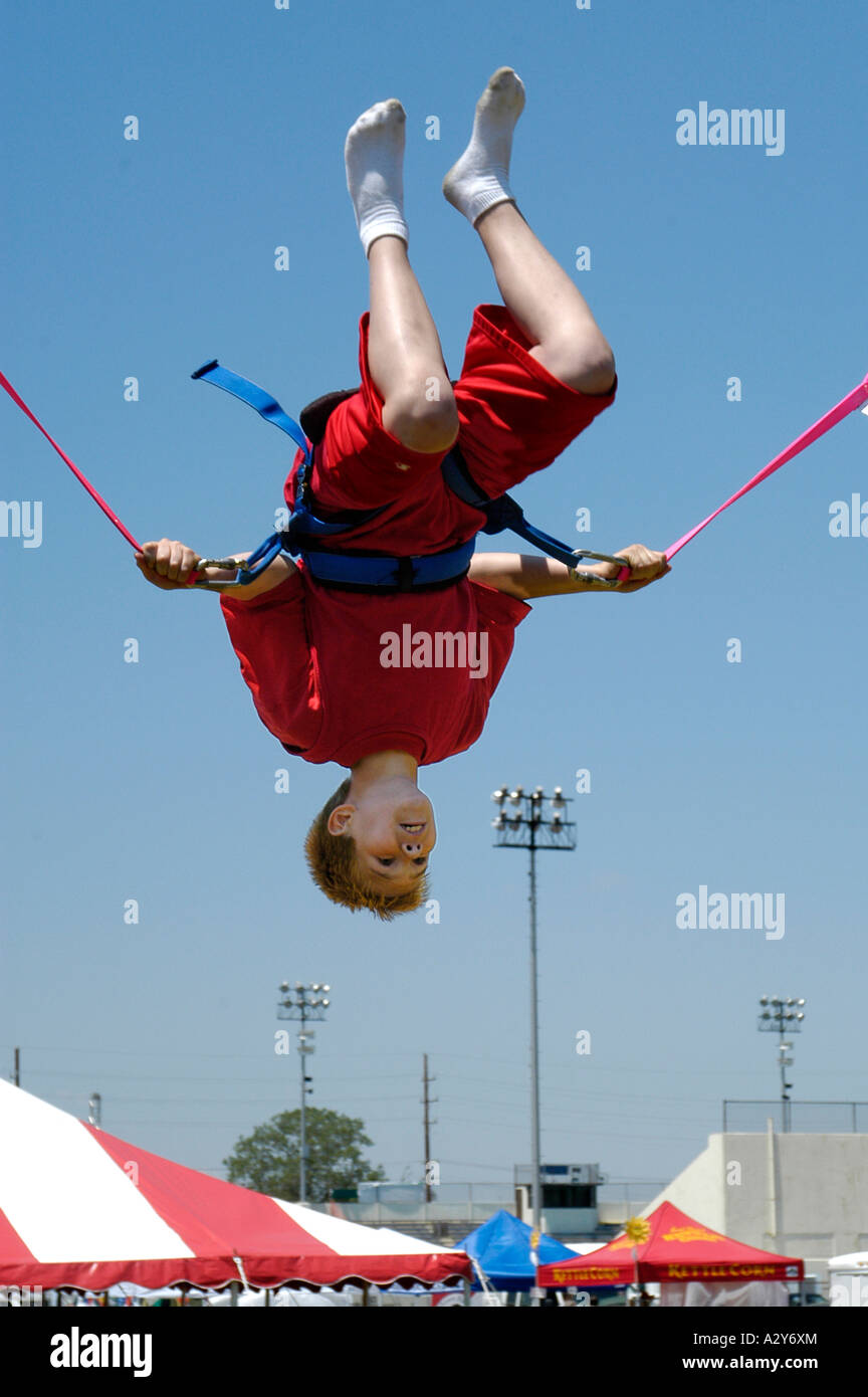 Young boy having fun on a carnival ride Stock Photo - Alamy