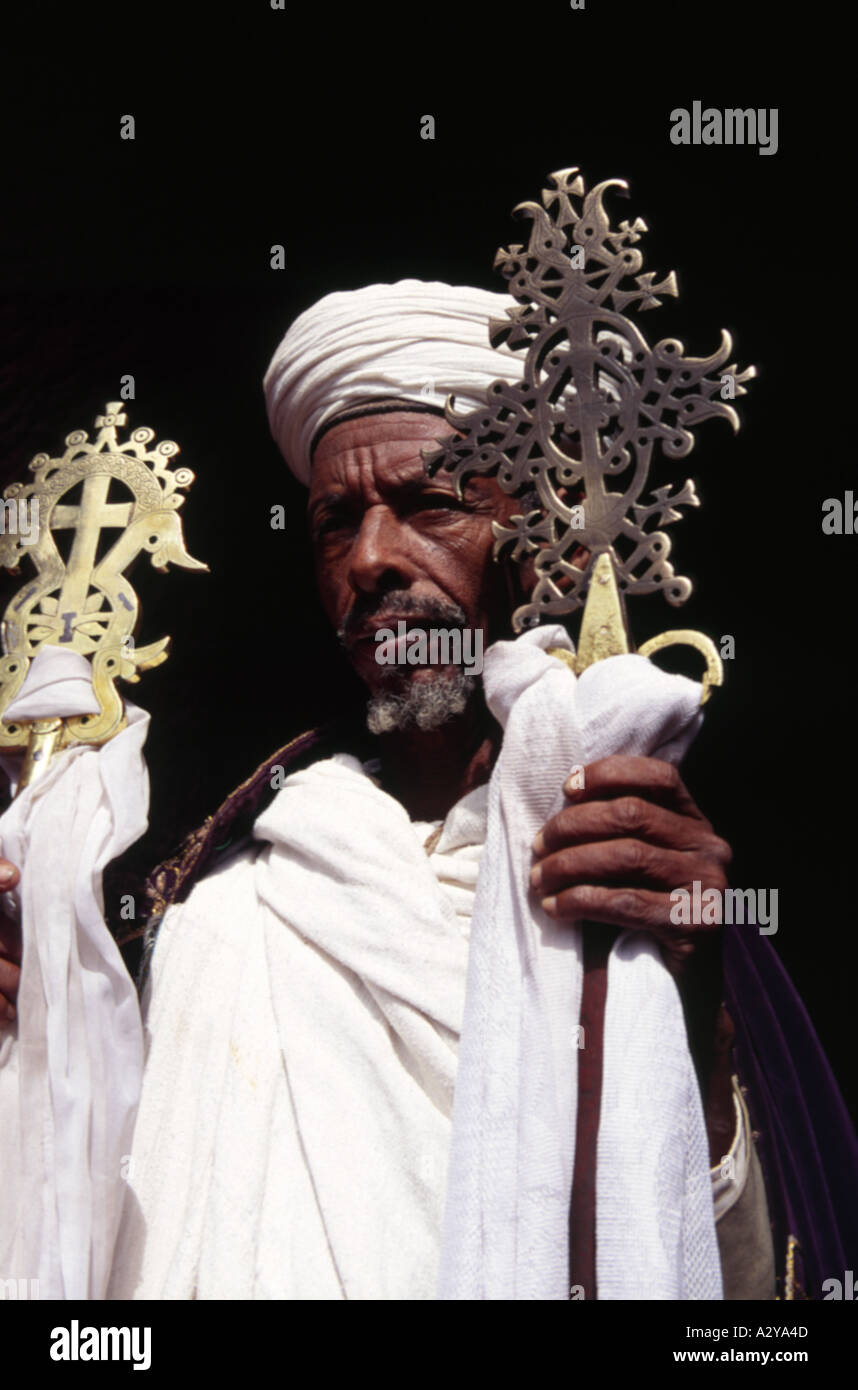 Orthodox Ethiopian priest holds up ceremonial crosses Lalibela ETHIOPIA Stock Photo Alamy