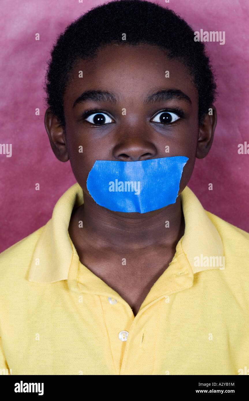 Shocked boy with Duct tape on his mouth Stock Photo