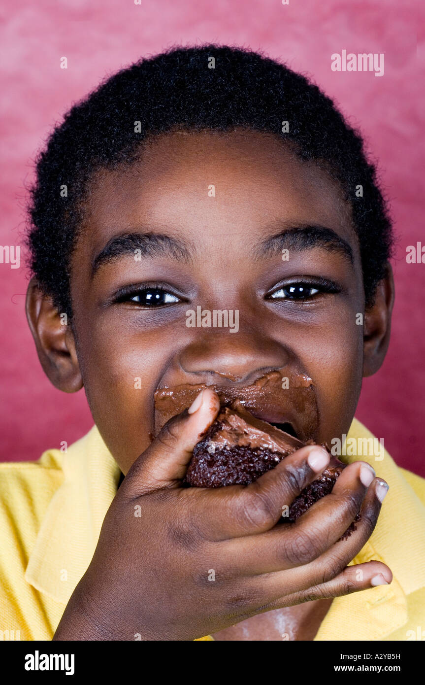 african-american-kid-eating-chocolate-cake-stock-photo-alamy