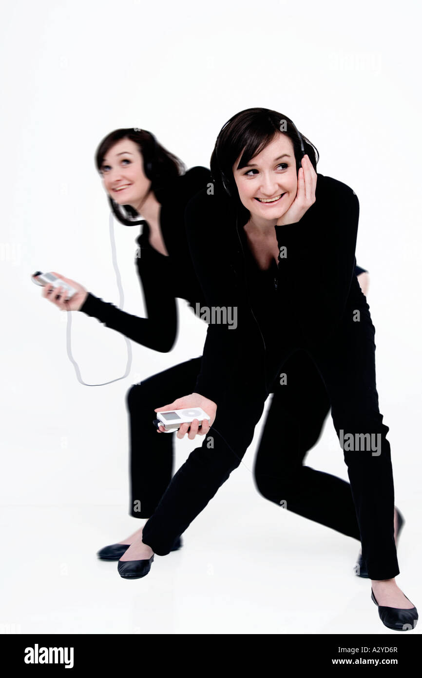 young woman with an ipod dancing and singing along Stock Photo