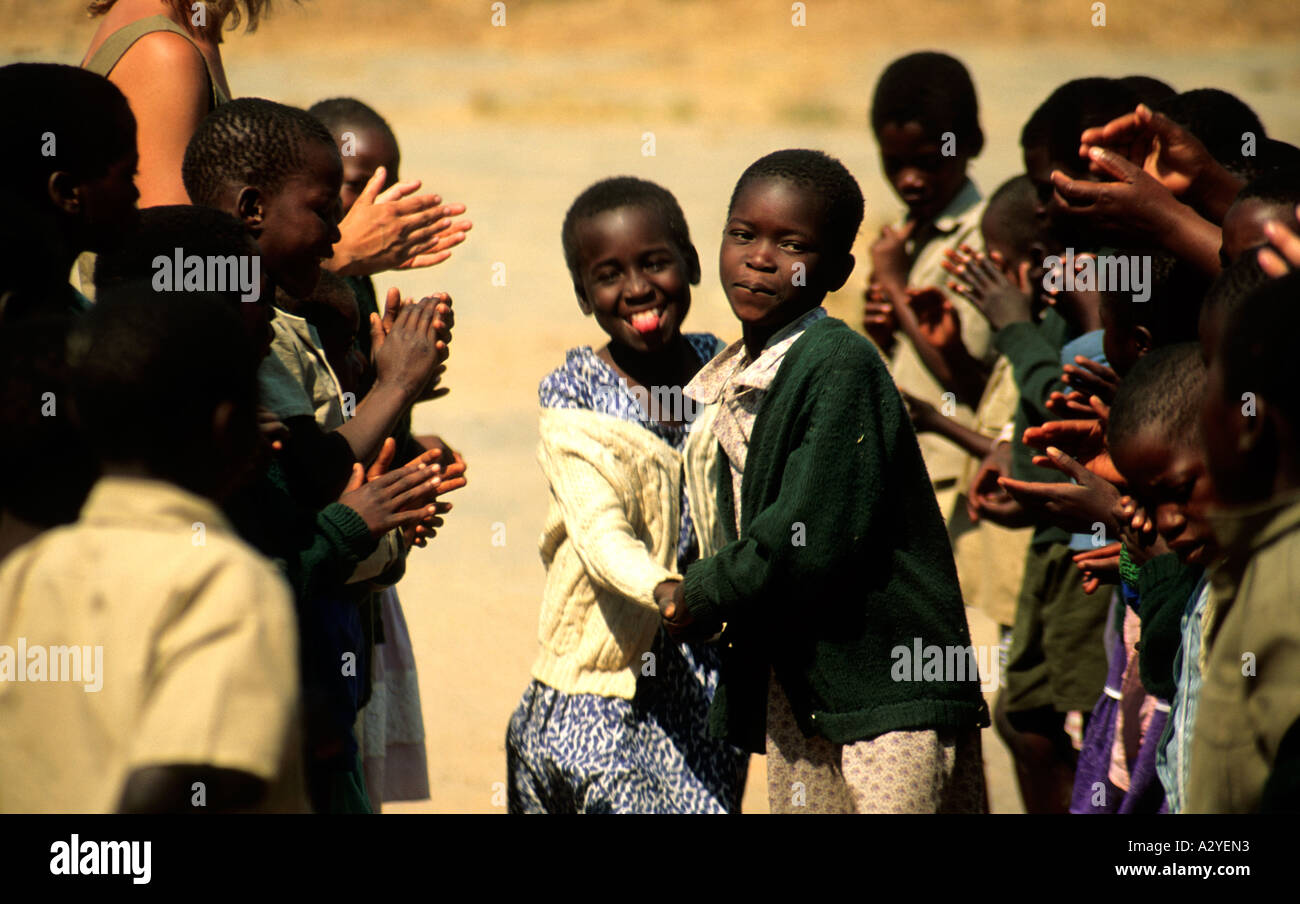 School children in Zimbabwe playing outside the classroom Stock Photo