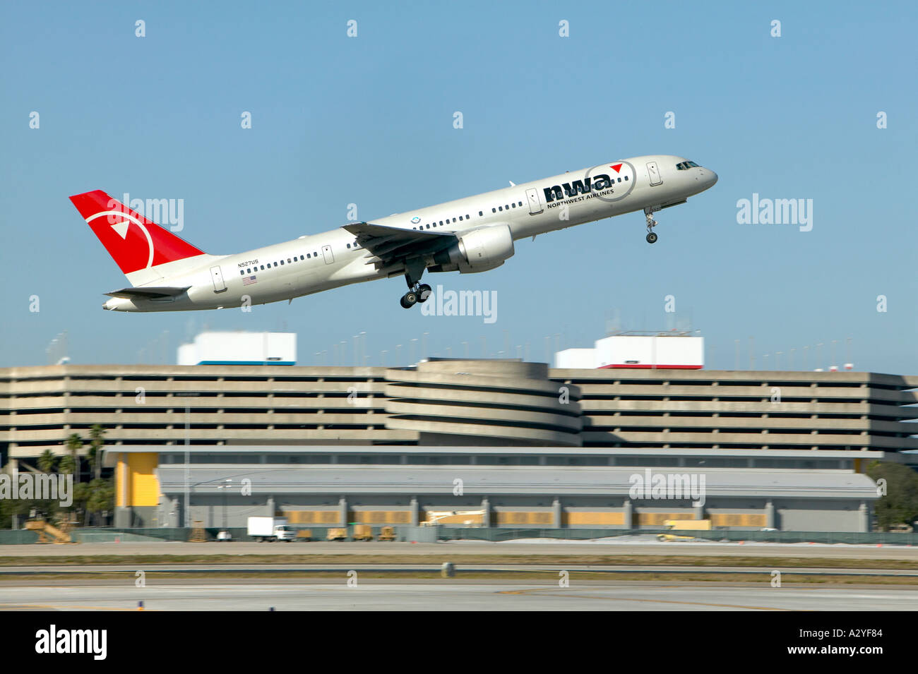 Northwest Boeing 757 251 passenger jet airplane taking off with landing gear out Stock Photo