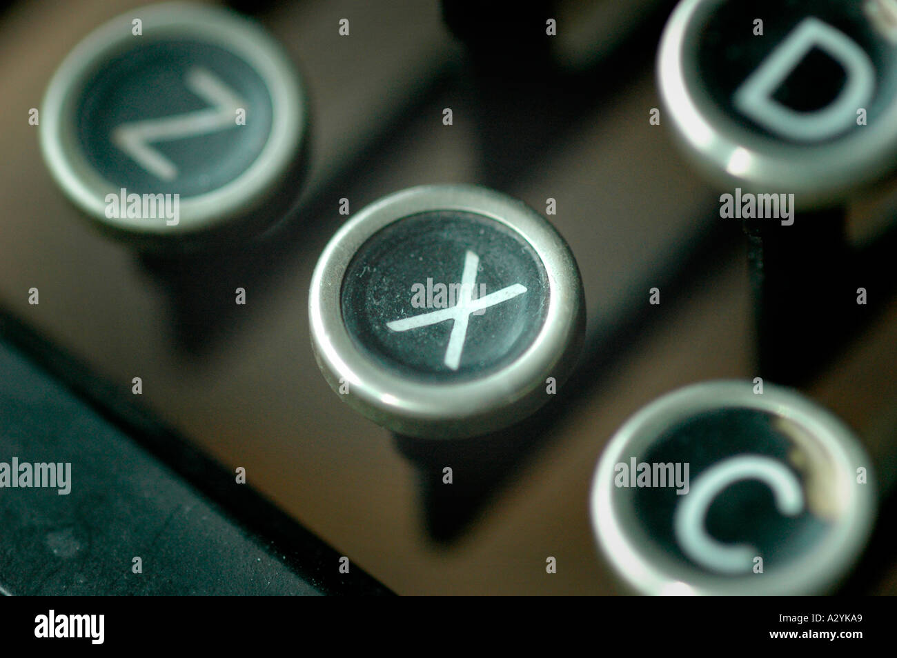 An Old manual typewriter with its working keys with numbers and letters X Out Gone Stock Photo