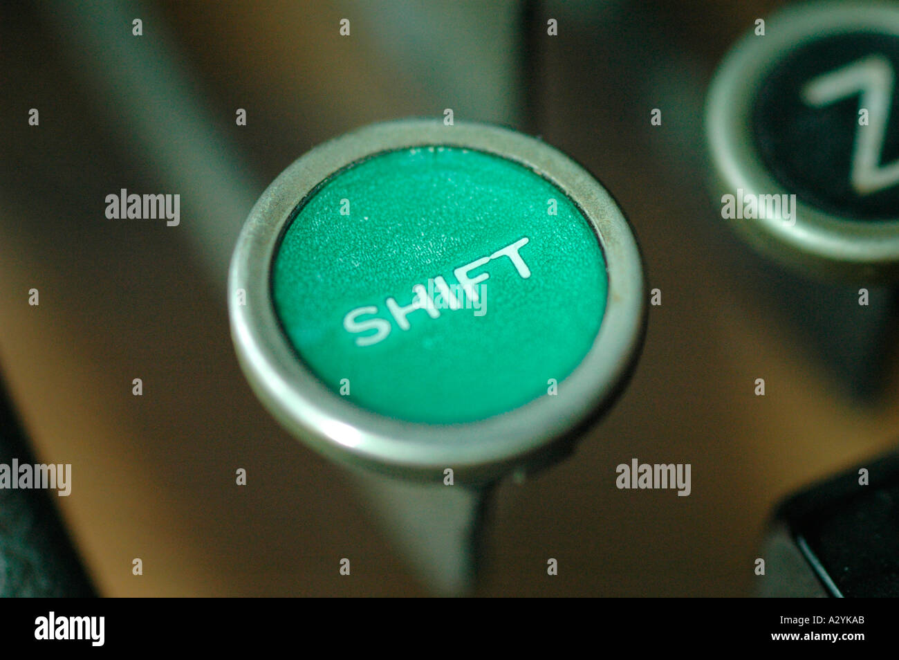 An Old manual typewriter with its working keyes with numbers and letters shift key green Stock Photo