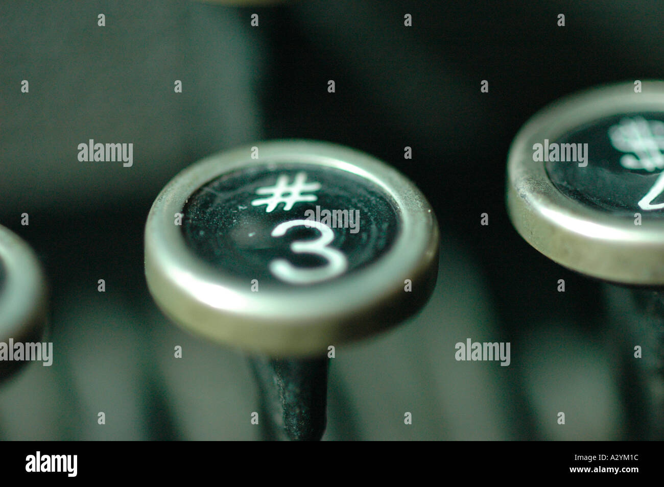 An Old manual typewriter with its working keys with numbers and letters hash mark number 3 Stock Photo