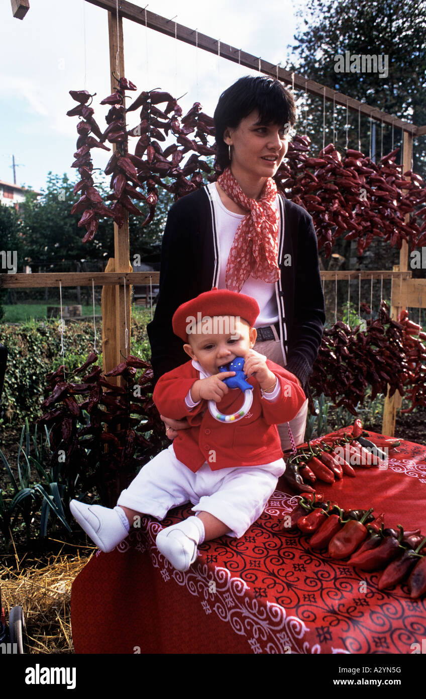 Basque Mother A young mother in Espelette in the French Pyrenees has dressed her baby ...