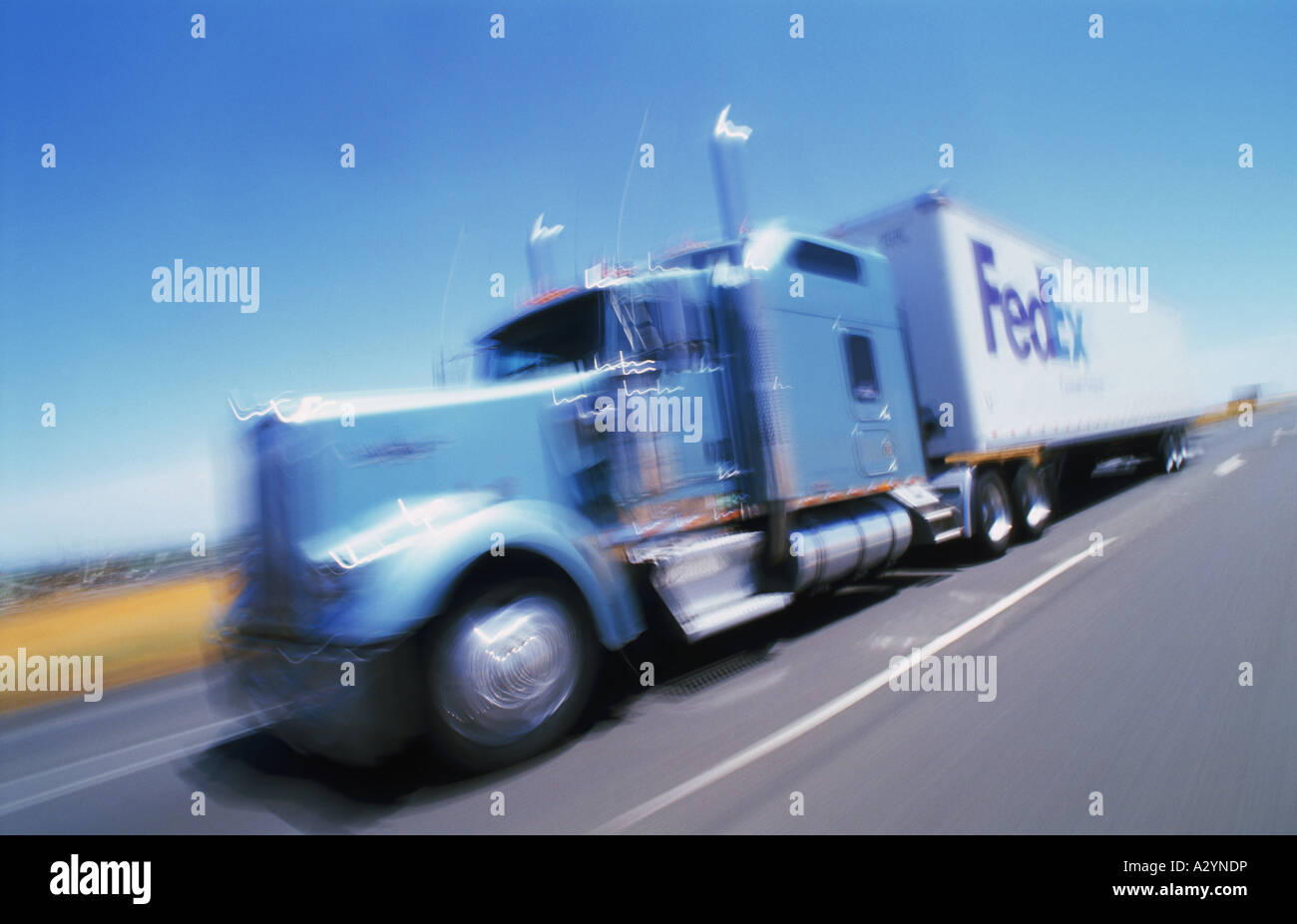 Federal  Express truck racing along California highway Stock Photo