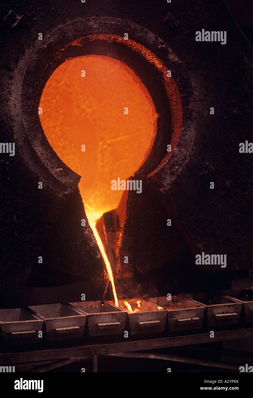 Pouring molten gold to form ingots in a South African gold mine Stock Photo