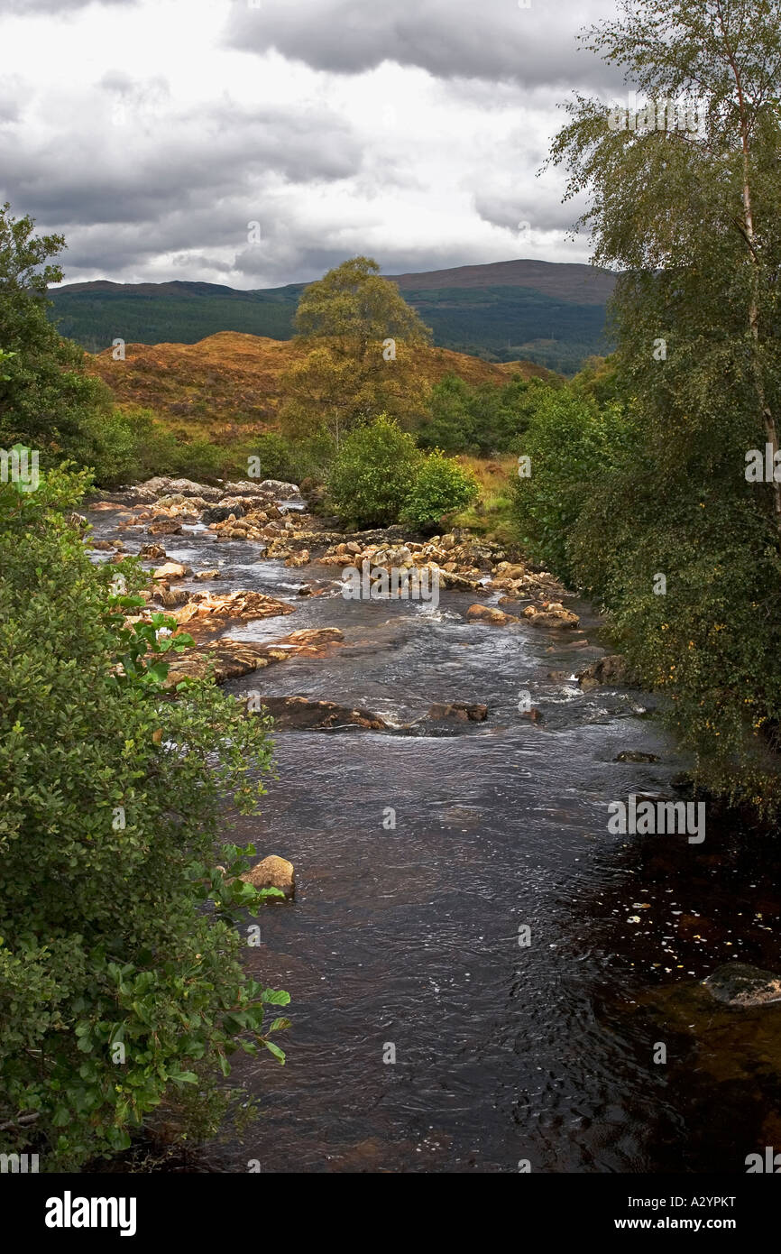 Fast flowing stream in Scottish landscape near Loch Garry, Garrygualach, Invergarry, Scotand, UK Stock Photo