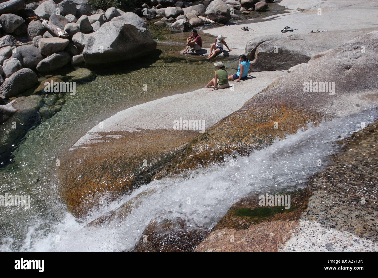 hikers cooling off in creek Sequoia National Park California Stock Photo