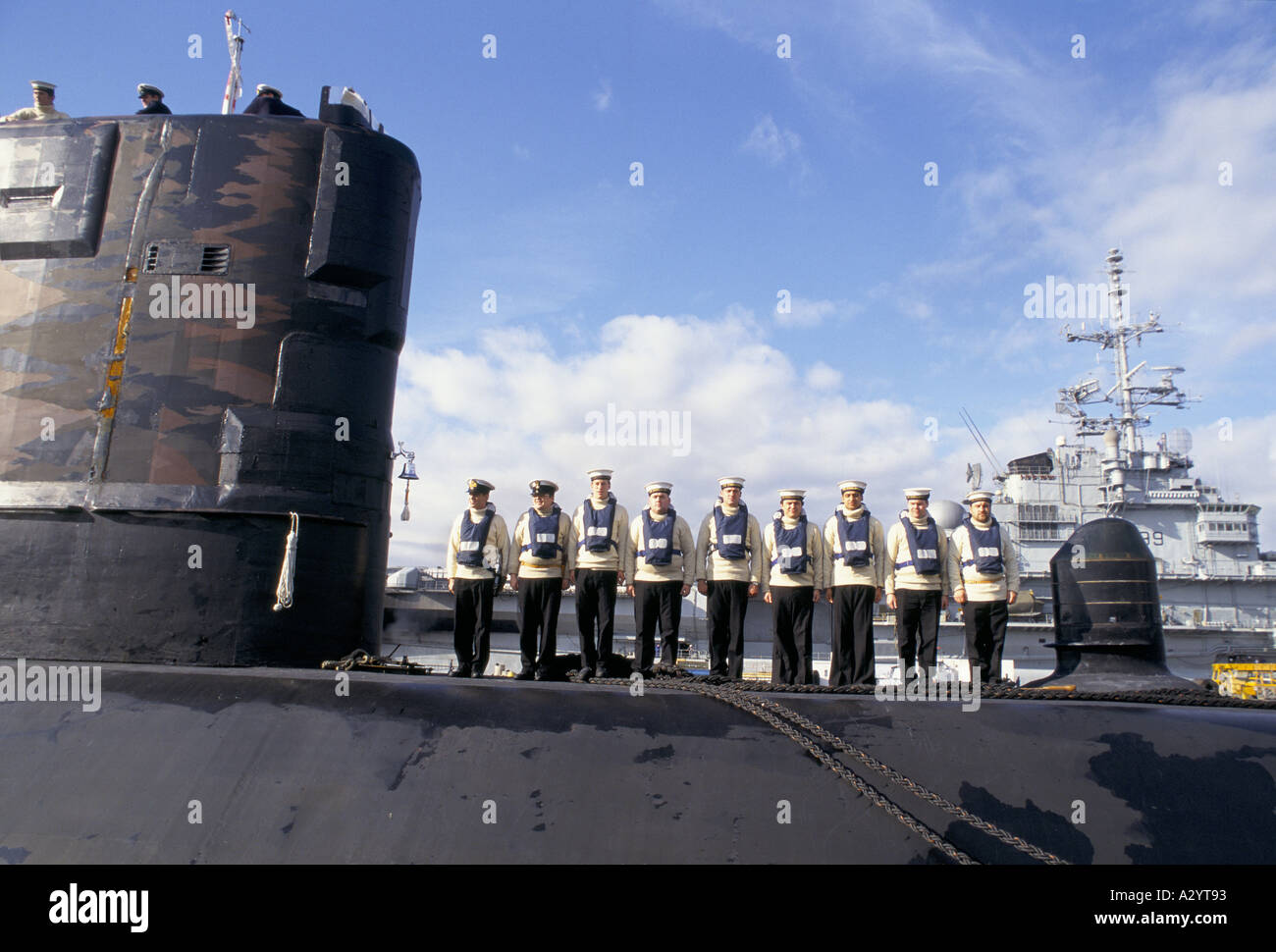 submarine crew standing to attention on deck Stock Photo