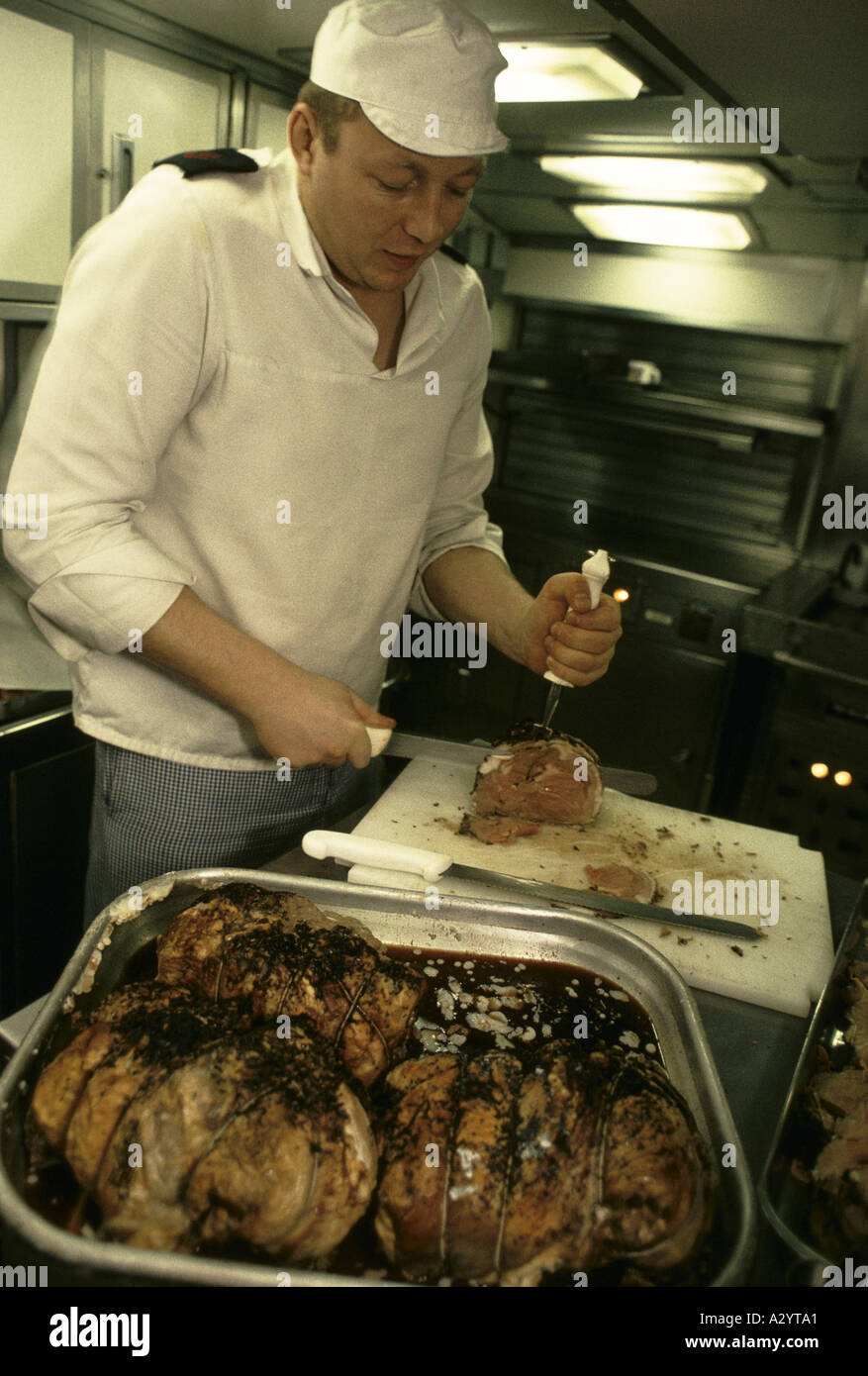 navy cook preparing dinner for submarine crew Stock Photo